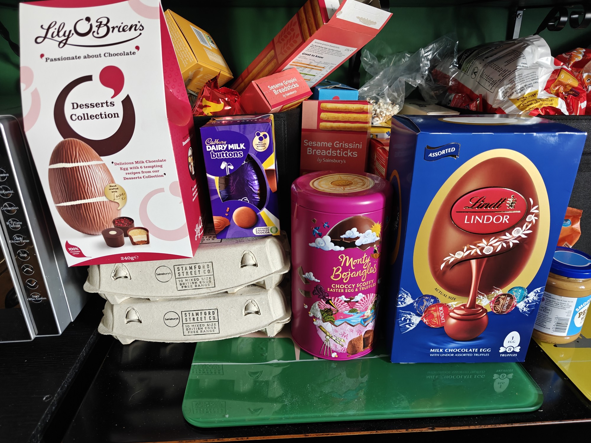 A stack of Easter eggs, including Lindor and Cadbury's