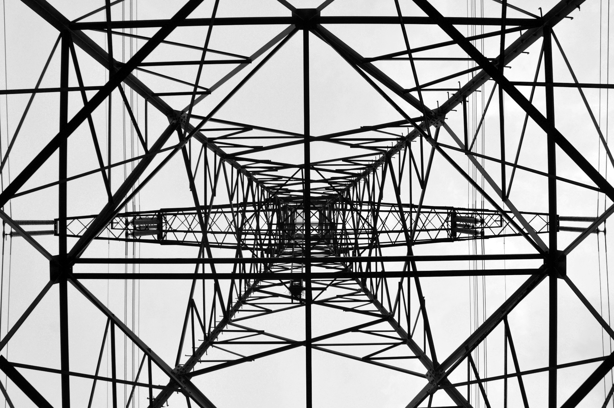 A decorative image of an electricity pylon, looking up from the bottom, inside it 