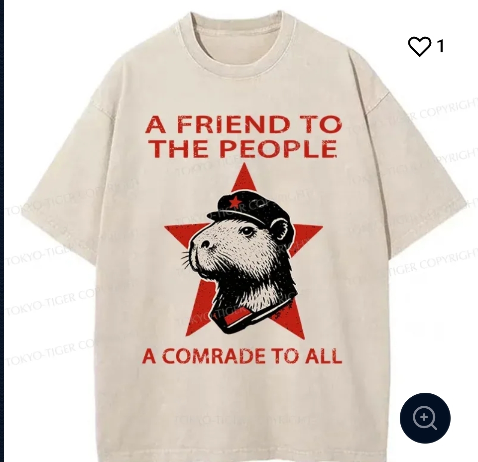 A t shirt that says "a friend the people. A comrade to all" with a capybara wearing a communist cap inside a star 
