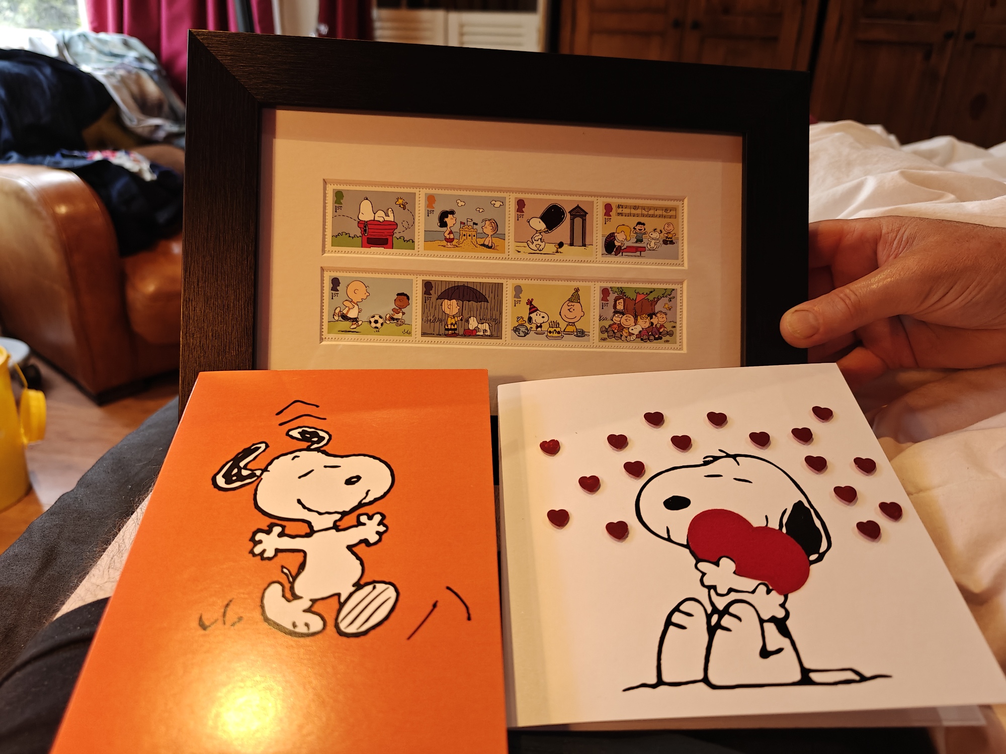 Two Snoopy cards and a set of Snoopy stamps given as a gift