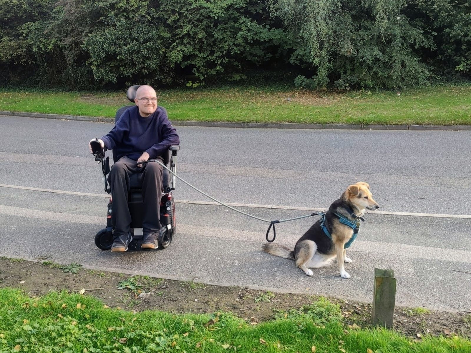 A picture of me, in my wheelchair, with my dog, Robyn. 