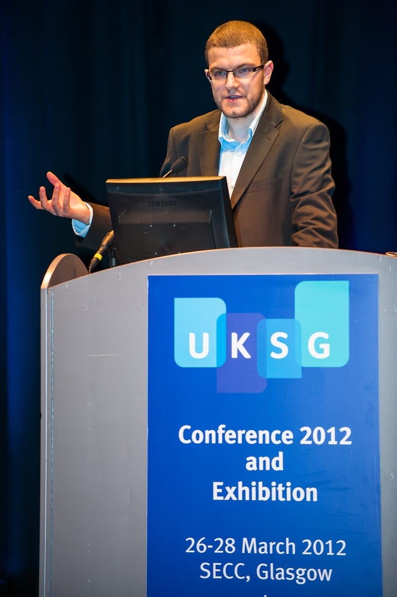 A picture of me at a lectern, giving a talk at UKSG conference in 2012