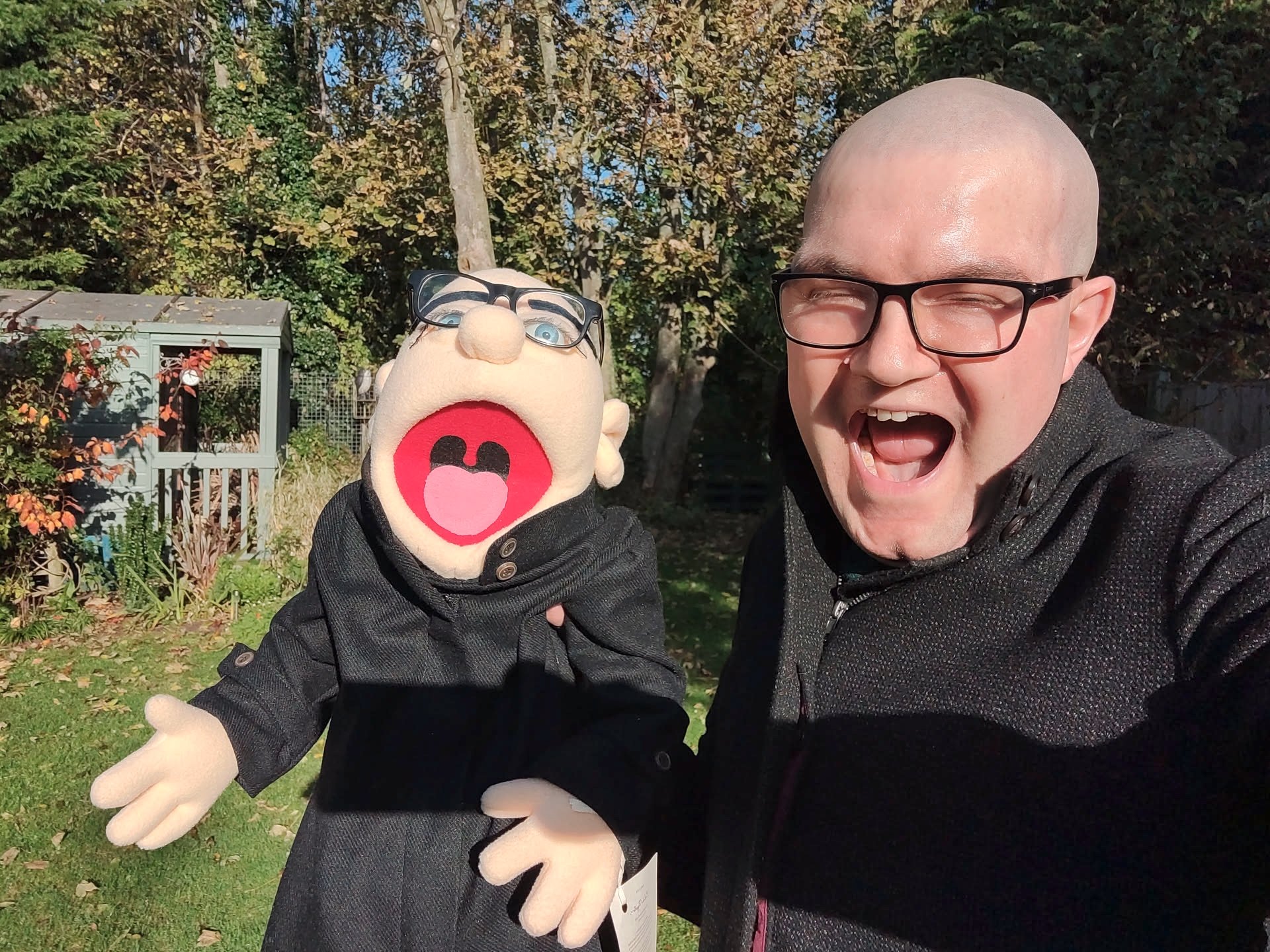 A picture of me holding a Muppet version of me 