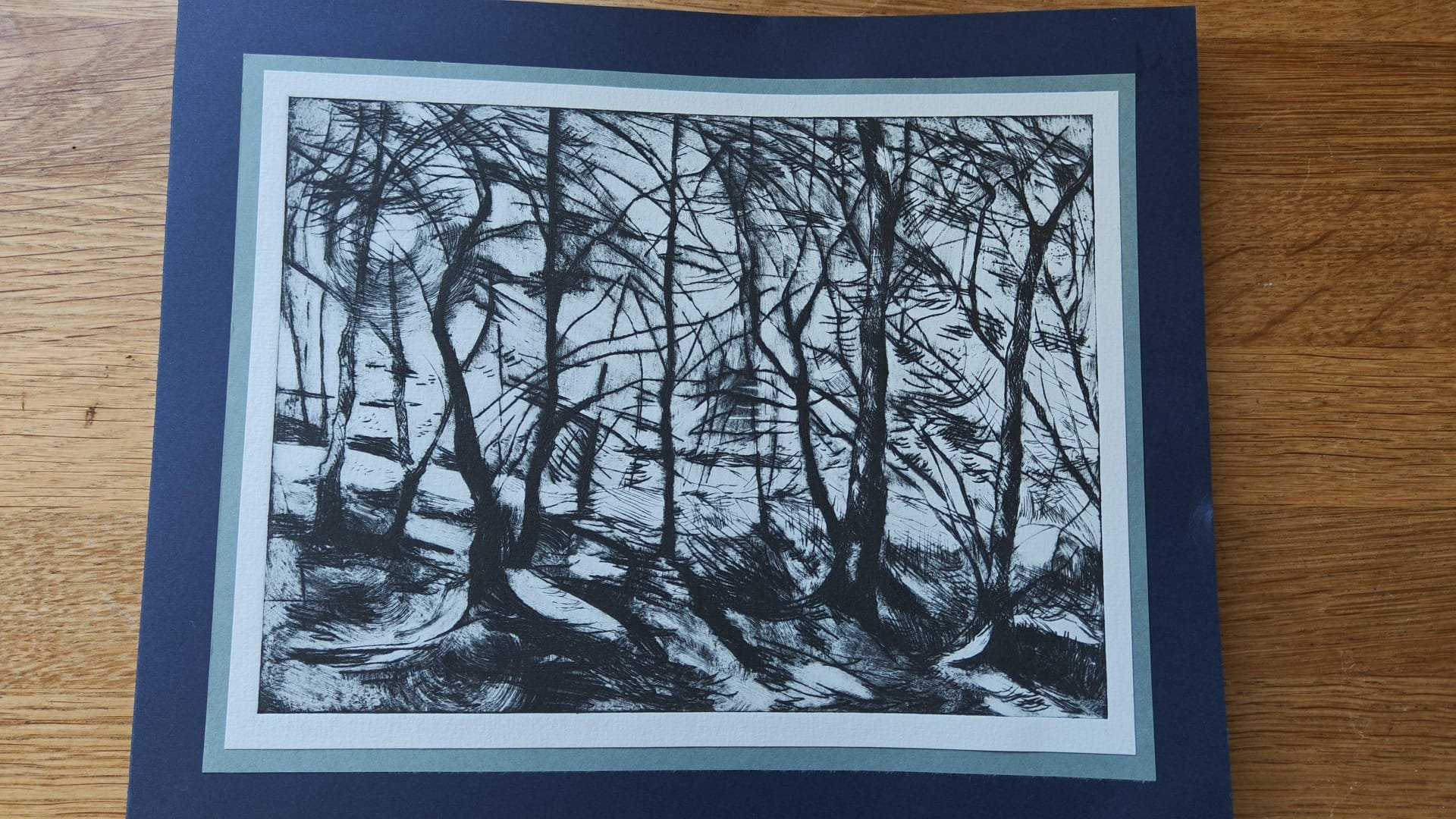 A card with an etching of a forest and trees by Caroline Matthews