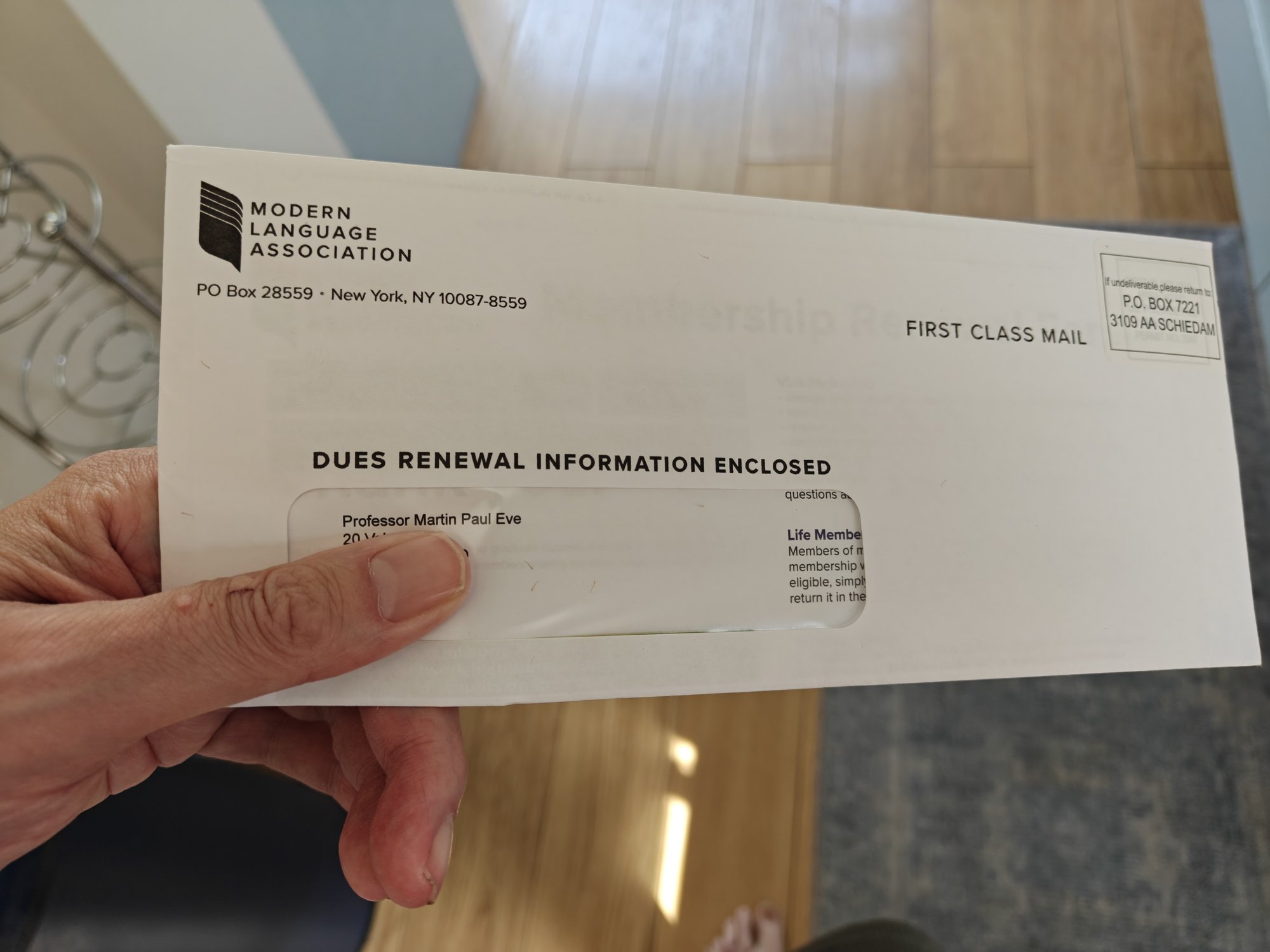 An unopened letter/envelope addressed to me that says "DUES RENEWAL INFORMATION ENCLOSED" on the envelope with clear markings of the Modern Language Association at the top left. 
