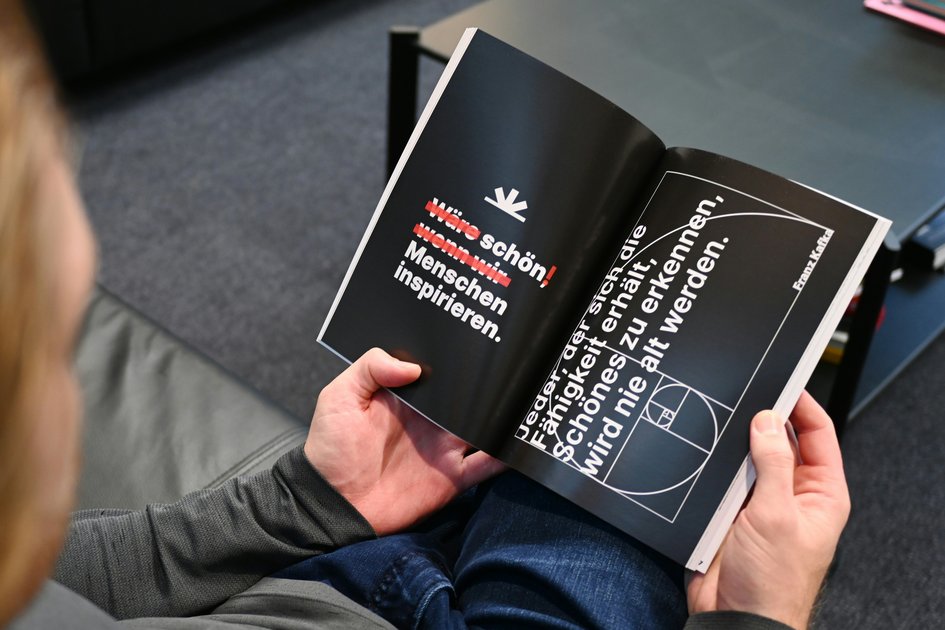 An image of a person looking at an open book